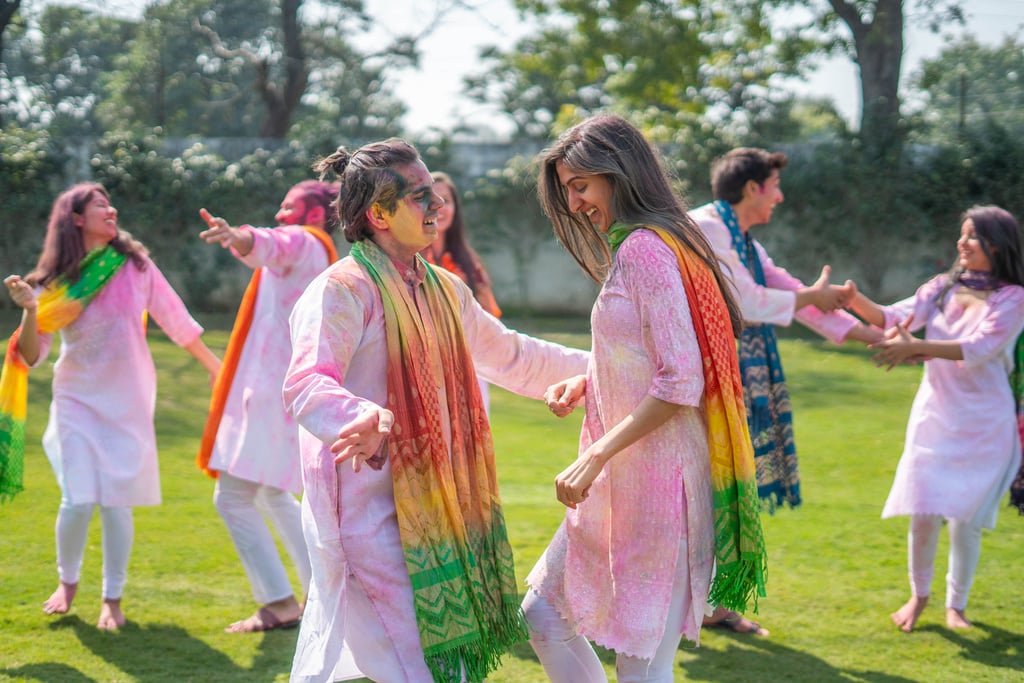 Indian couple playing Holi